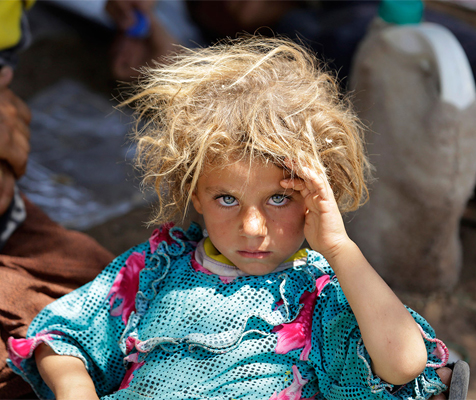Youssef Boudlal, Moroccan Photographer based Casablanca, Morocco, born Oujda, Morocco - “A girl from the minority Yazidi sect, fleeing the violence in the Iraqi town of Sinjar, rests at the Iraqi-Syrian border crossing in Fishkhabour, August 14, 2014