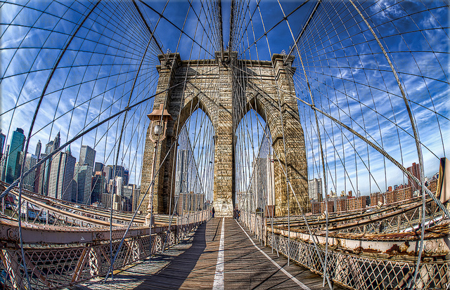 Brooklyn Bridge is a bridge in New York City and is one of the oldest suspension bridges in the United States (Brooklyn Bridge fisheye, looking towards Manhattan. New York City), credit Sayed Dhansay, Flickr