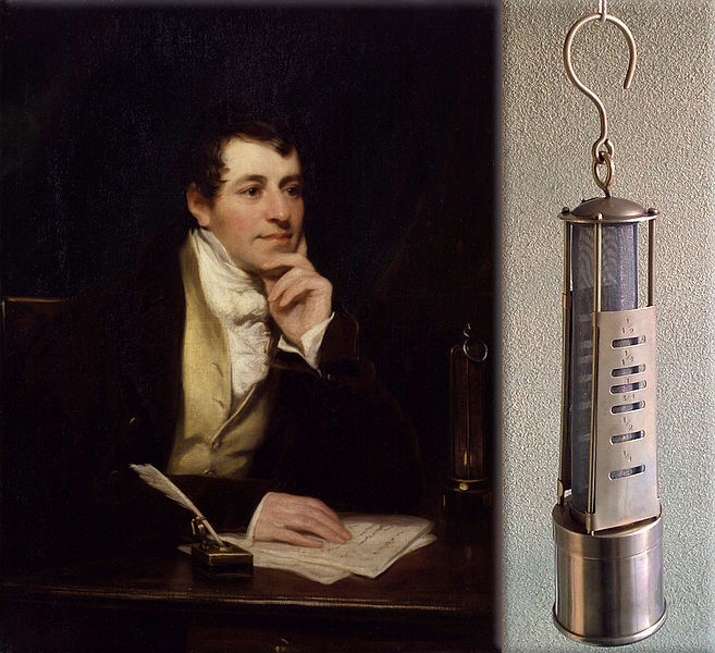 Sir Humphry Davy tests the Davy lamp for miners at Hebburn Colliery (A type of Davy lamp with apertures for gauging flame height)