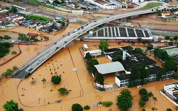At least 21 people are killed by flooding and mudslides in and around São Paulo, Brazil, following heavy rain.