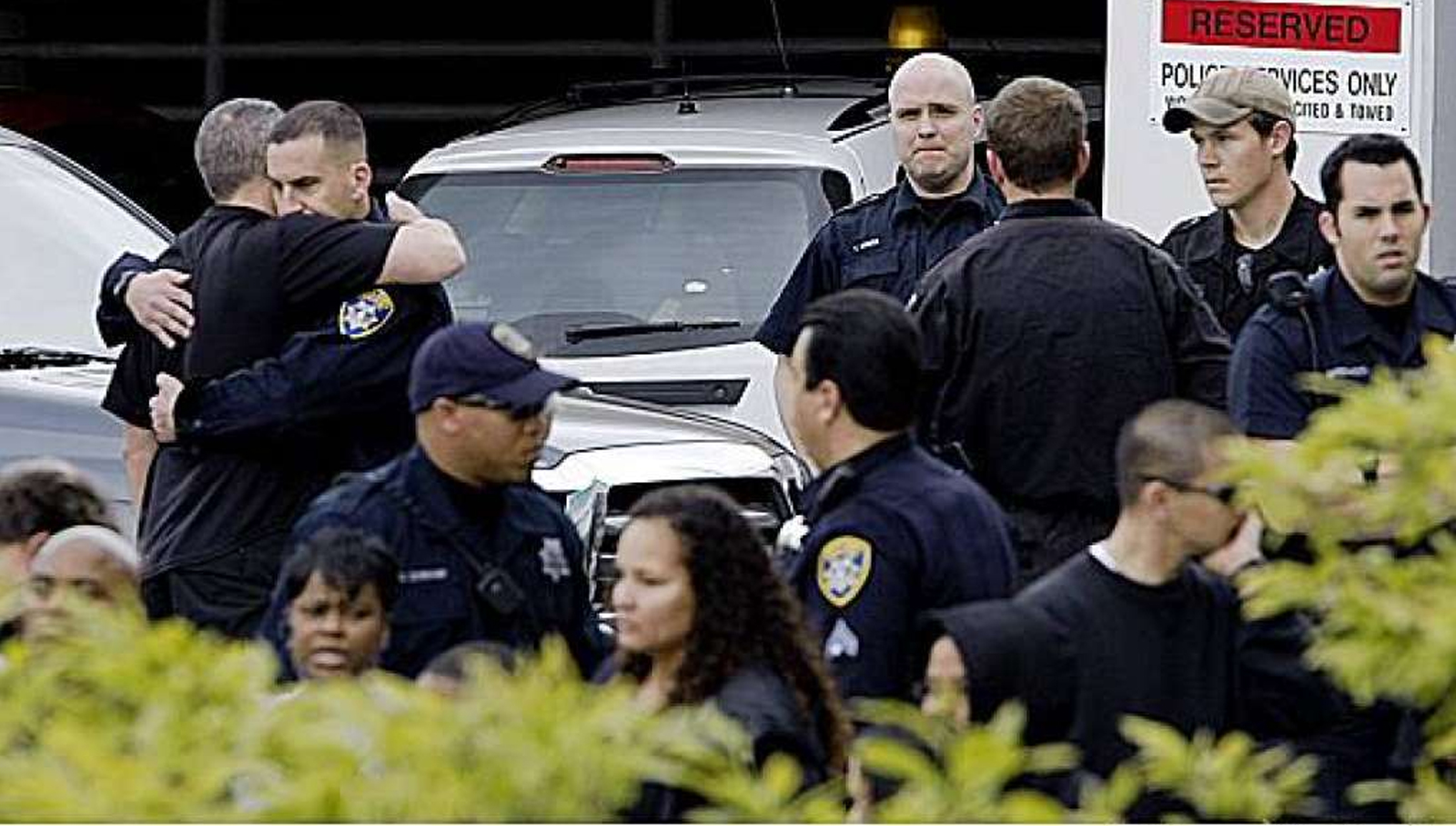 Four police officers are shot and killed and a fifth is wounded in two shootings at Oakland, California.