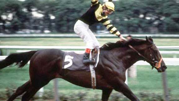 Seattle Slew won the Belmont Stakes, capturing the Triple Crown