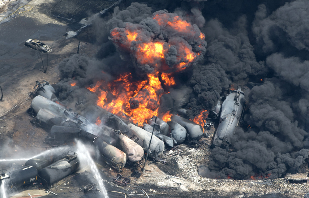 Lac-Mégantic derailment: A 73-car oil train derails in the town of Lac-Mégantic, Quebec and explodes into flames, killing at least 47 people and destroying more than 30 buildings in the town's central area. (AP Photo/The Canadian Press, Paul Chiasson)