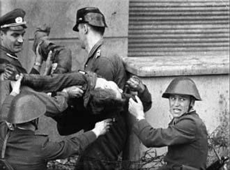 Berlin Wall: East German border guards kill 18-year-old Peter Fechter as he attempts to cross the Berlin Wall into West Berlin becoming one of the first victims of the wall