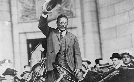 While campaigning in Milwaukee, Wisconsin, the former President of the United States, Theodore Roosevelt, is shot and mildly wounded by John Schrank, a mentally-disturbed saloon keeper. With the fresh wound in his chest, and the bullet still within it, Mr. Roosevelt still carries out his scheduled public speech