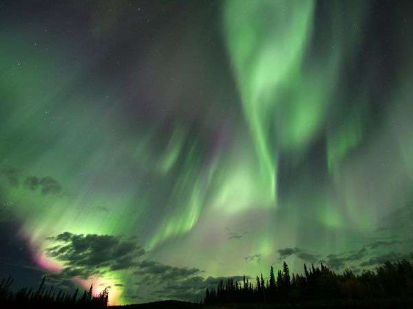 A geomagnetic storm causes the Aurora Borealis to shine so brightly that it is seen clearly over parts of USA, Europe and Japan