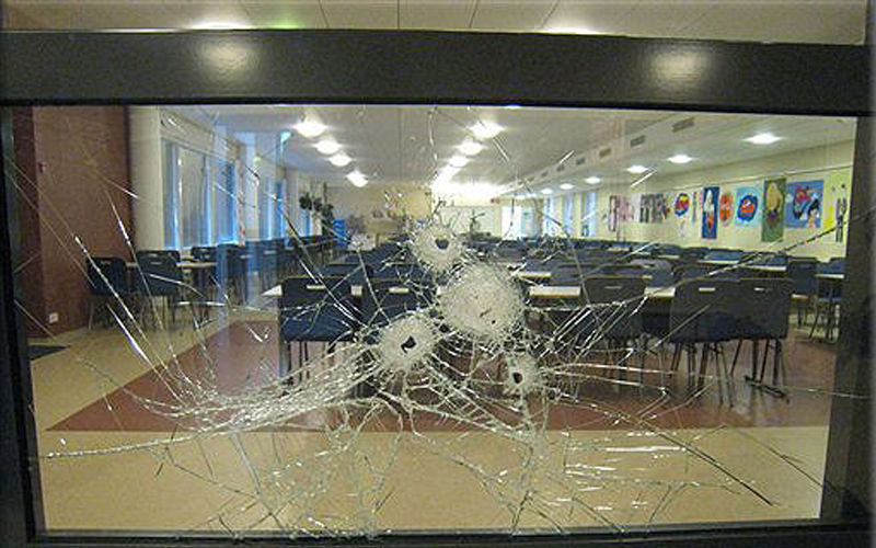 Jokela school shooting: Bullet holes in glass are seen on the first floor of the Jokela school center in Tuusula, Finland, Thursday, Nov. 8. 2007, a day after a deadly shooting at the school. AP / Finland NBI, CBS News